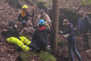 Wilderness rescue training group in woods